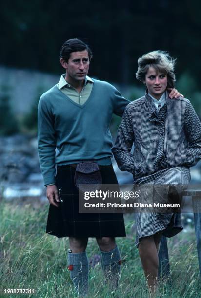 Charles III of the United Kingdom and Diana, Princess of Wales , wearing a suit designed by Bill Pashley, pose for a portrait along the banks of the...