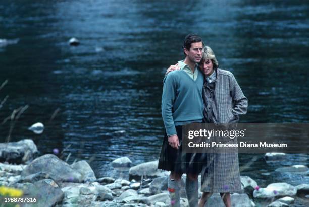 Charles III of the United Kingdom and Diana, Princess of Wales , wearing a suit designed by Bill Pashley, pose for a portrait along the banks of the...