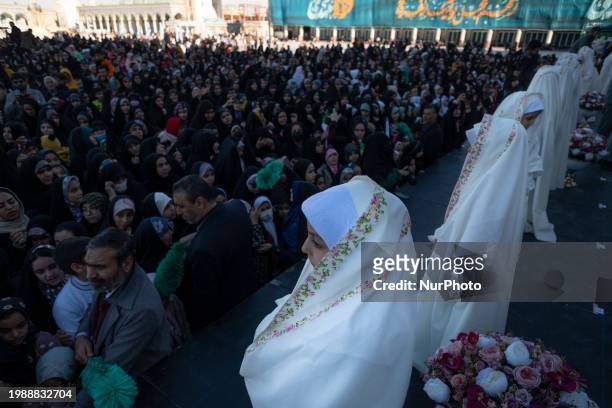 Veiled Iranian schoolgirls are participating in a ceremony at the holy mosque of Jamkaran on the outskirts of the holy city of Qom, 145 km south of...