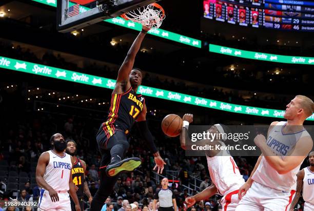 Onyeka Okongwu of the Atlanta Hawks dunks against Terance Mann of the LA Clippers during the first quarter at State Farm Arena on February 05, 2024...