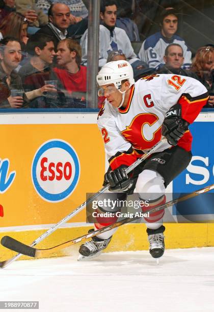 Jarome Iginla of the Calgary Flames skates against the Toronto Maple Leafs during NHL game action on January 13, 2004 at Air Canada Centre in...