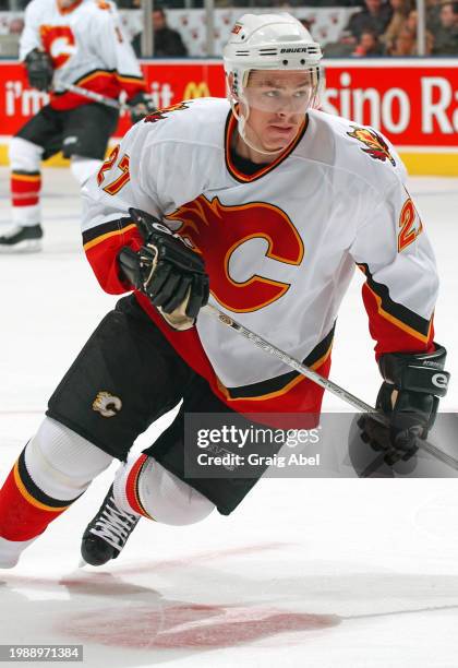 Steven Reinprecht of the Calgary Flames skates against the Toronto Maple Leafs during NHL game action on January 13, 2004 at Air Canada Centre in...