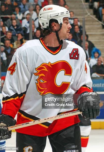 Rhett Warrener of the Calgary Flames skates against the Toronto Maple Leafs during NHL game action on January 13, 2004 at Air Canada Centre in...