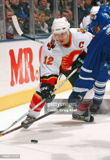 Jarome Iginla of the Calgary Flames skates against the Toronto Maple Leafs during NHL game action on January 13, 2004 at Air Canada Centre in...
