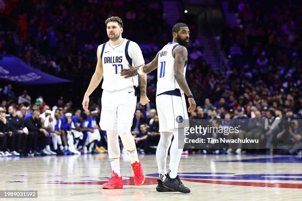 Luka Doncic of the Dallas Mavericks and Kyrie Irving of the Dallas Mavericks look on during the fourth quarter against the Philadelphia 76ers at the...