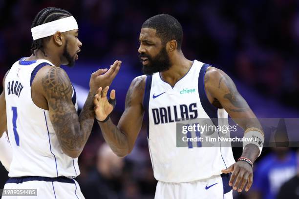 Jaden Hardy and Kyrie Irving of the Dallas Mavericks react during the fourth quarter against the Philadelphia 76ers at the Wells Fargo Center on...