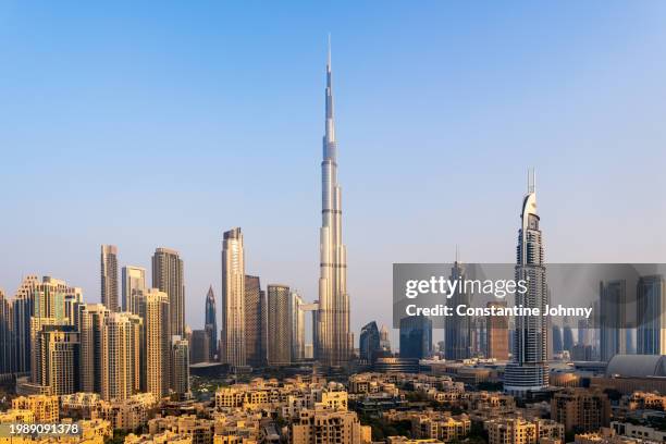 dubai architecture in morning glow - burj khalifa stock-fotos und bilder