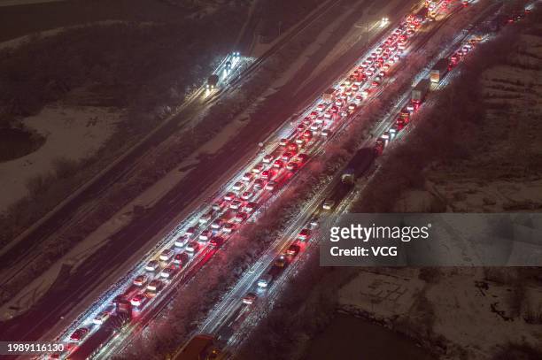 Aerial view of cars stuck in traffic jams caused by a heavy snowfall on February 4, 2024 in Wuhan, Hubei Province of China. Freezing rain and snow...