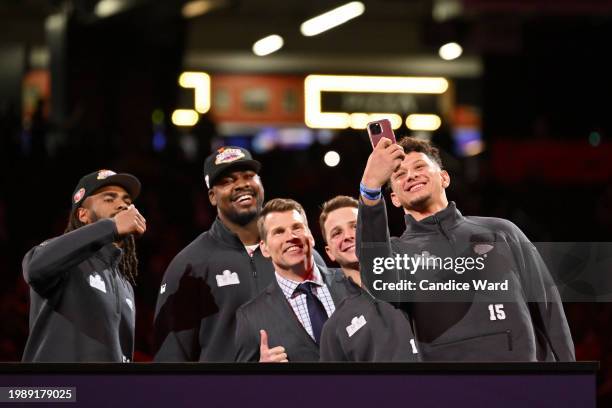 Fred Warner of the San Francisco 49ers, Chris Jones of the Kansas City Chiefs, Scott Hanson, Brock Purdy of the San Francisco 49ers, and Patrick...