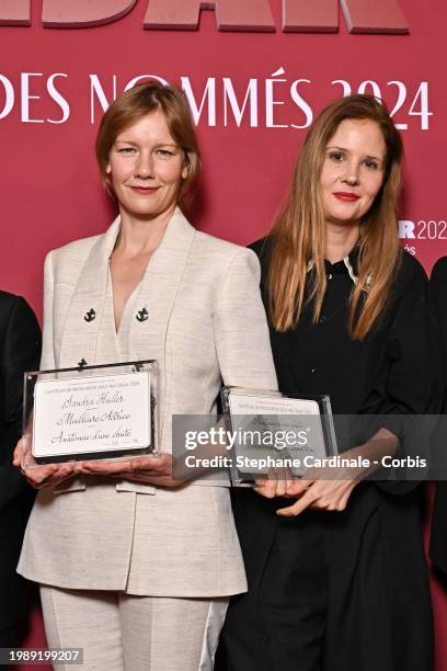 Sandra Hüller and Justine Triet attend the Cesar 2024 - Nominee Dinner at Le Fouquet's on February 05, 2024 in Paris, France.