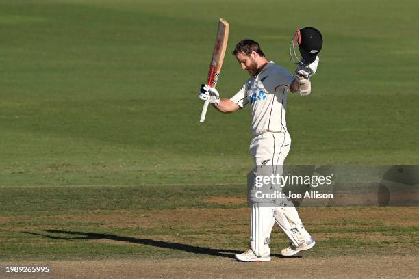 Kane Williamson of New Zealand raises his bat after scoring a century during day three of the First Test in the series between New Zealand and South...