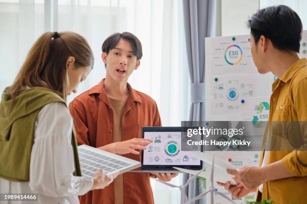 group diversity business esg meeting environment, society and governance, discussing renewable energy with wind turbine and solar panel,net zero emission business ethical, reduce carbon footprint pollution greenhouse gas, reuse and recycle for sdgs - circular economy stock pictures, royalty-free photos & images