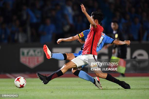 Yu Kobayashi of Kawasaki Frontale and Wataru Endo of Urawa Red Diamonds compete for the ball during the J.League J1 match between Kawasaki Frontale...