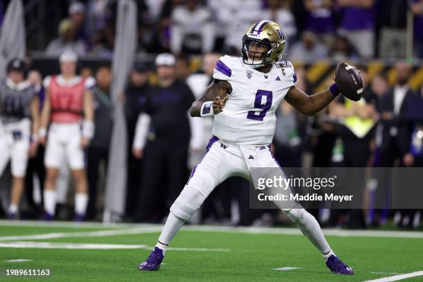 Michael Penix Jr. #9 of the Washington Huskies throws the ball in the first quarter against the Michigan Wolverines during the 2024 CFP National...