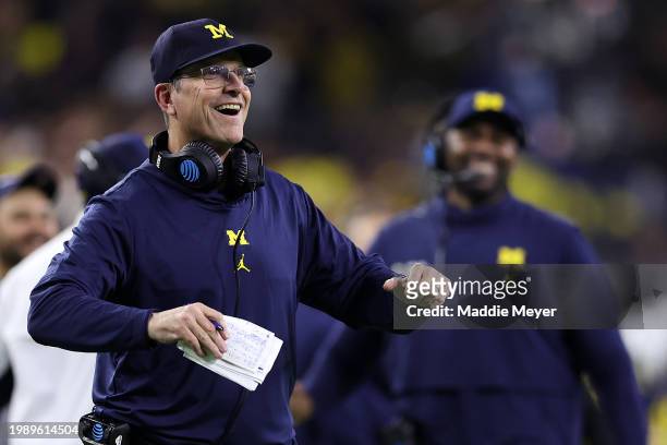 Head coach Jim Harbaugh of the Michigan Wolverines looks on in the first half against the Washington Huskies during the 2024 CFP National...