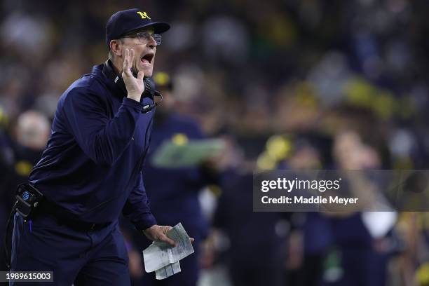 Head coach Jim Harbaugh of the Michigan Wolverines looks on in the first half against the Washington Huskies during the 2024 CFP National...