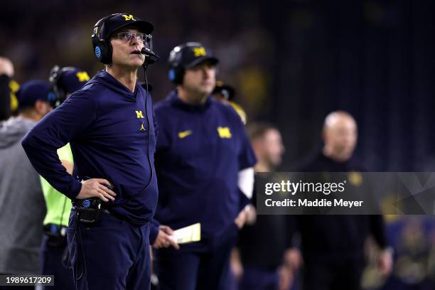 Head coach Jim Harbaugh of the Michigan Wolverines looks on in the first half against the Washington Huskies during the 2024 CFP National...