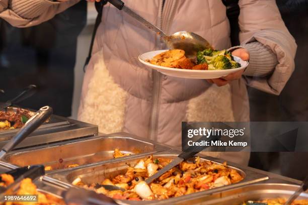 Eat as much as you like hot buffet at a Chinese restaurant in Chinatown on 5th February 2024 in London, United Kingdom. Many people eat bargain food...