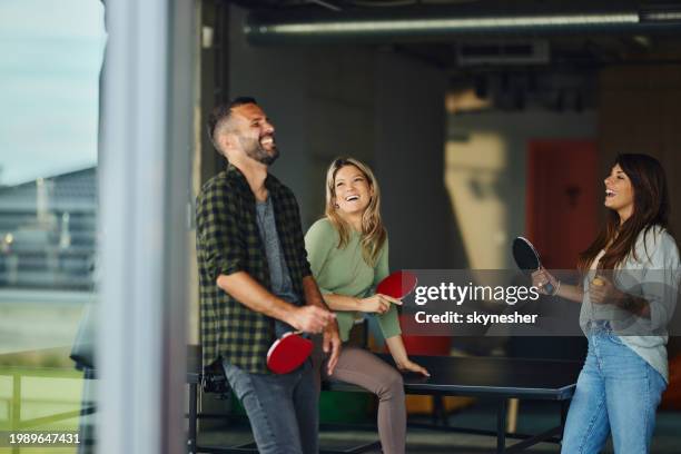 happy friends talking before table tennis game. - table tennis stock pictures, royalty-free photos & images