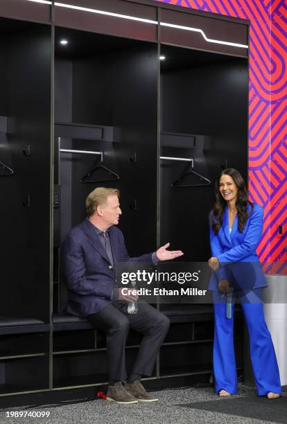 Commissioner Roger Goodell and reporter Tracy Wolfson talk as they wait for the start of a news conference ahead of Super Bowl LVIII at Allegiant...