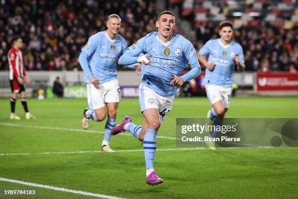 Phil Foden of Manchester City celebrates scoring his team's second goal during the Premier League match between Brentford FC and Manchester City at...