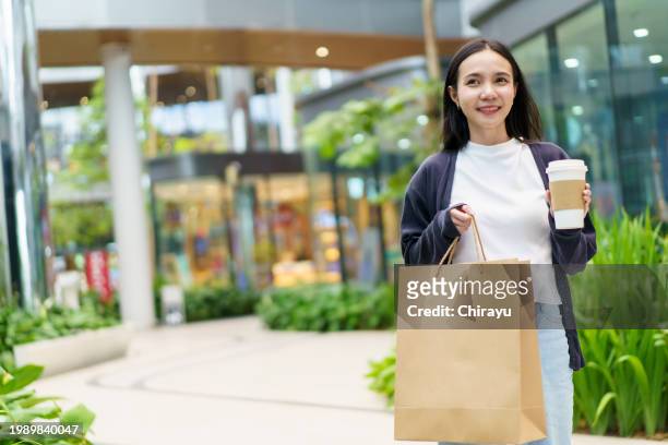 woman walking in the community mall. - ethiopia city stock pictures, royalty-free photos & images