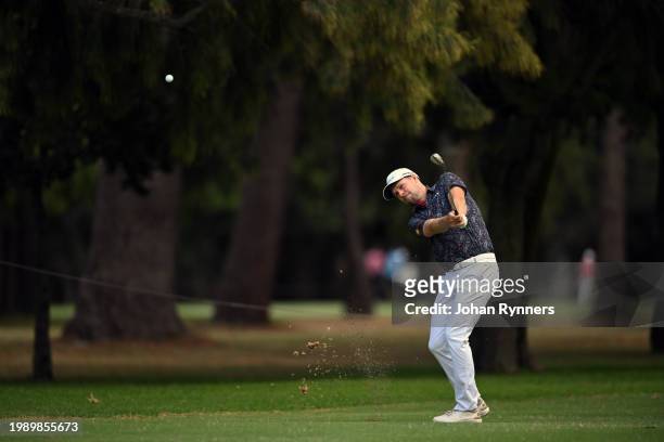 Martin Simonsen of Denmark plays his shot from the fairway on the eleventh hole during day two of the Bain's Whisky Cape Town Open at Royal Cape Golf...