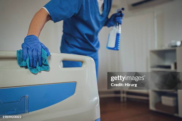 nurse cleaning hospital ward - handschuhe stock-fotos und bilder