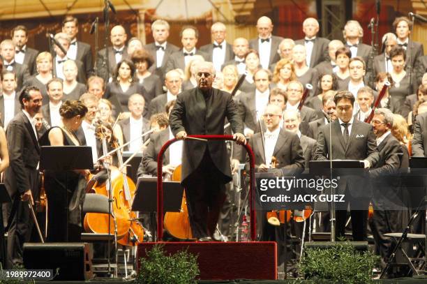 Argentinian conductor and pianist Daniel Barenboim arrived to conduct Milan's La Scala opera compagny during a free open air concert of Verdi's...