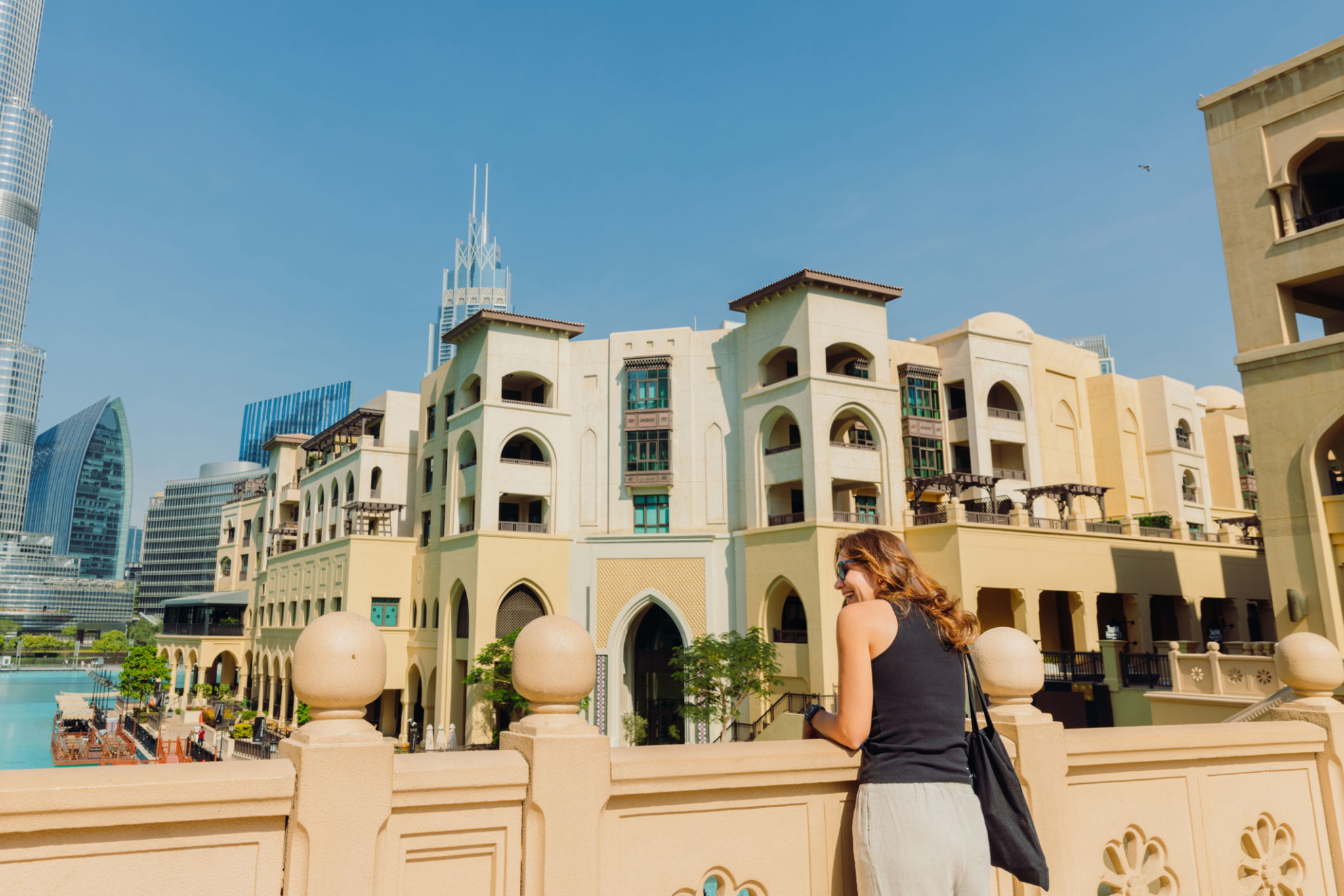Middle Eastern Woman Contemplating Scenic View of Dubai Downtown Cityscape Middle Eastern Woman Contemplating Scenic View of Dubai Downtown Cityscape