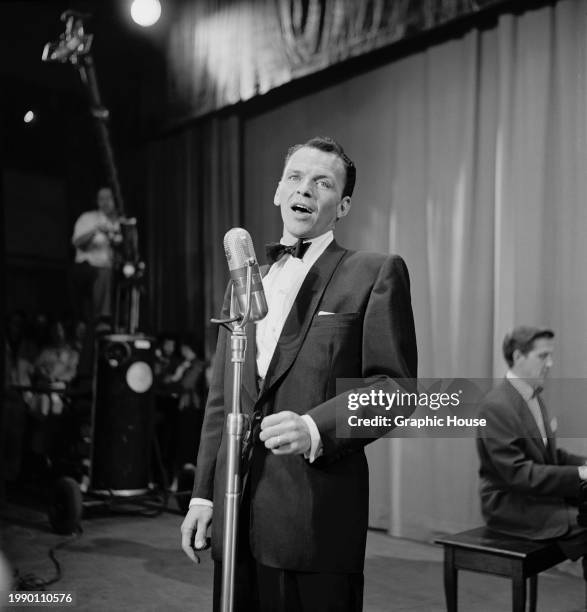 American singer and actor Frank Sinatra, wearing a tuxedo and bow tie, performs during the United Cerebral Palsy telethon, at the studios of KECA-TV...
