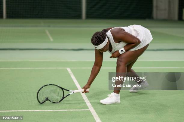 tennis player is disappointed after match - self defeat stock pictures, royalty-free photos & images