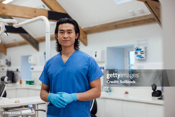 orthodontist cheerful portrait - male healthcare worker stock pictures, royalty-free photos & images
