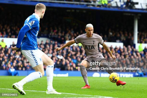 Richarlison of Tottenham Hotspur scores the opening goal during the Premier League match between Everton FC and Tottenham Hotspur at Goodison Park on...