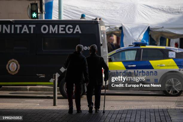 Several people watch the work of emergency operatives after the collapse of a building in Badalona, February 6 in Badalona, Barcelona, Catalonia,...