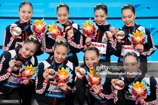 Athletes of Japan show the bronze medal after competing in the artistic swimming mixed team technical final during the 21st World Aquatics...