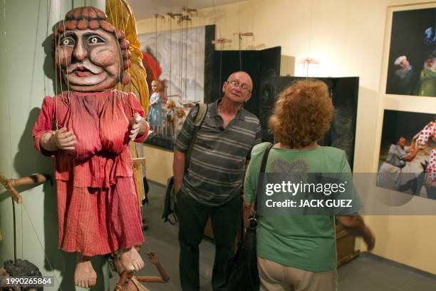 Israeli visitors tour a puppets exhibition at the Puppet Theater Center on July 20, 2010 in Holon, south of the coastal city of Tel Aviv, during the...