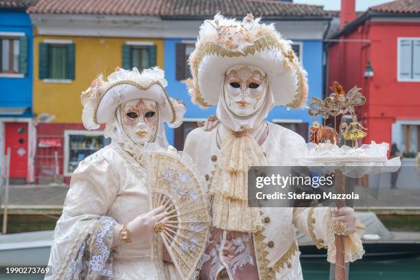 Masked revelers pose for a portrait at the island of Burano during the Venice Carnival 2024 on February 06, 2024 in Venice, Italy. The Venice...