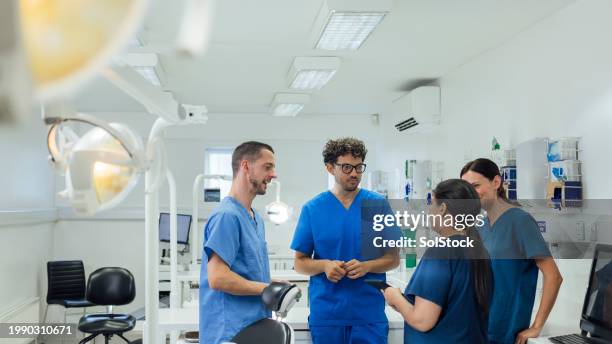 dentists talking in a group - tandhälsa bildbanksfoton och bilder