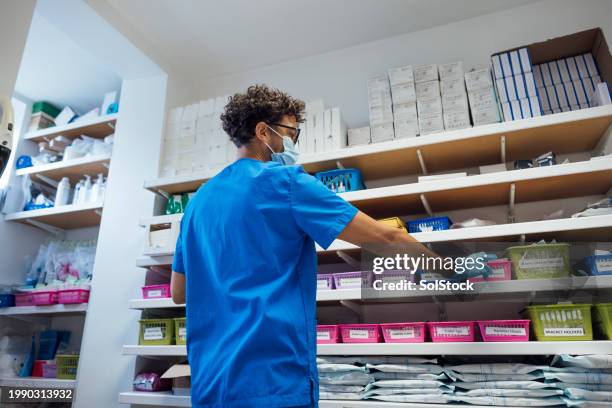 working with medicines - surgical mask and gloves stock pictures, royalty-free photos & images