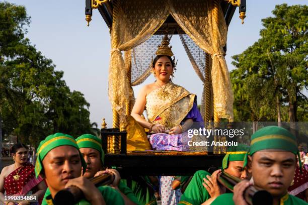 Woman dressed as royalty is carried during the parade to commemorate King Narai The Great, a royal leader during the Ayutthaya era, in Lopburi,...