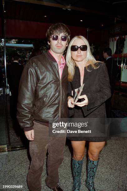 English musician Noel Gallagher and Meg Mathews attend the UK film premiere of Brian De Palma's 'Mission Impossible' at the Empire cinema, Leicester...