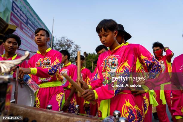 Drummers play music on the street during the parade to commemorate King Narai The Great, a royal leader during the Ayutthaya era, in Lopburi,...