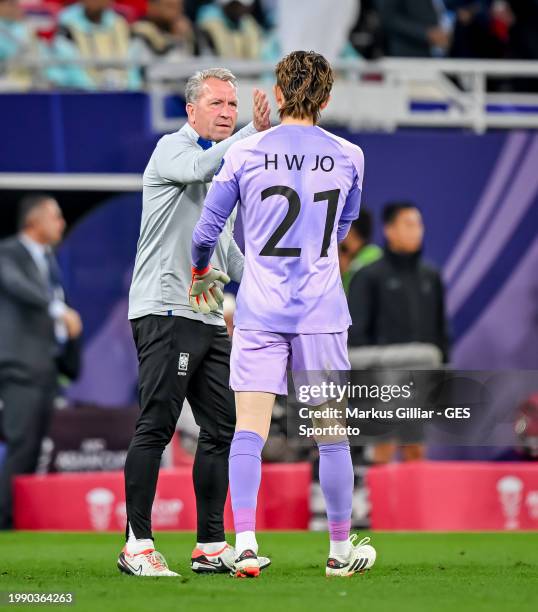 Andreas Koepke of South Korea reacts with Jo Hyeon-woo during the AFC Asian Cup semi final match between Jordan and South Korea at Ahmad Bin Ali...