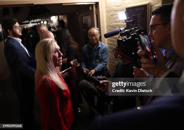 Rep. Marjorie Taylor Greene speaks to reporters as she departs from a House Republican caucus meeting at the U.S. Capitol on February 06, 2024 in...