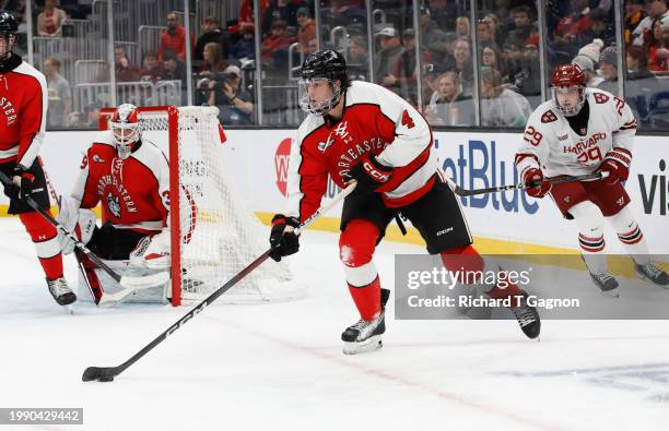 Pito Walton of the Northeastern Huskies skates against the Harvard Crimson during NCAA hockey in the semifinals of the annual Beanpot Hockey...