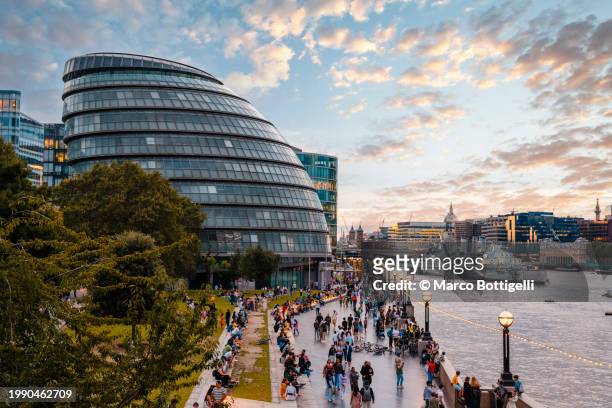 gla building and thames river at sunset, london, uk - urban life stock pictures, royalty-free photos & images