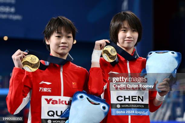 Gold Medalists, Yuxi Chen and Hongchan Quan of Team People's Republic of China pose with their medals during the Medal Ceremony after the Women's...