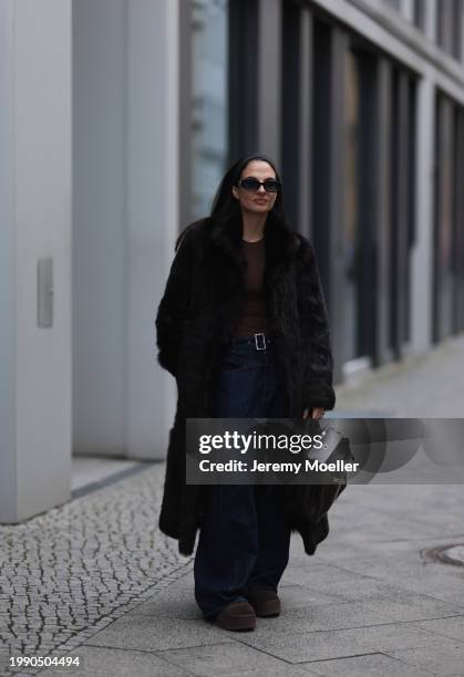 Anna Winter seen wearing Linda Farrow x The Attico black sunglasses, Gant dark brown fake fur long coat, Skims brown long sleeve top, closed dark...