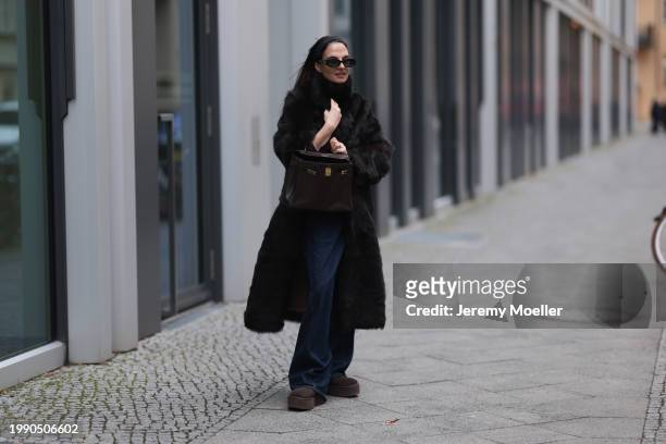 Anna Winter seen wearing Linda Farrow x The Attico black sunglasses, Gant dark brown fake fur long coat, Skims brown long sleeve top, closed dark...